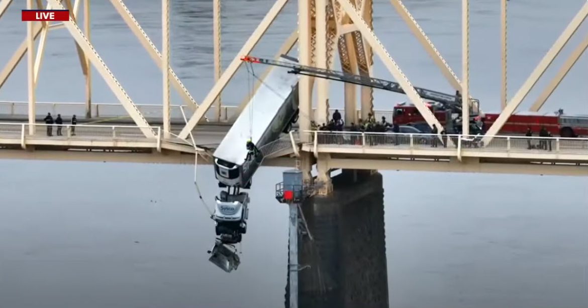 Dramatic Rescue: Semitruck Driver Safely Retrieved From Perilous Bridge Situation